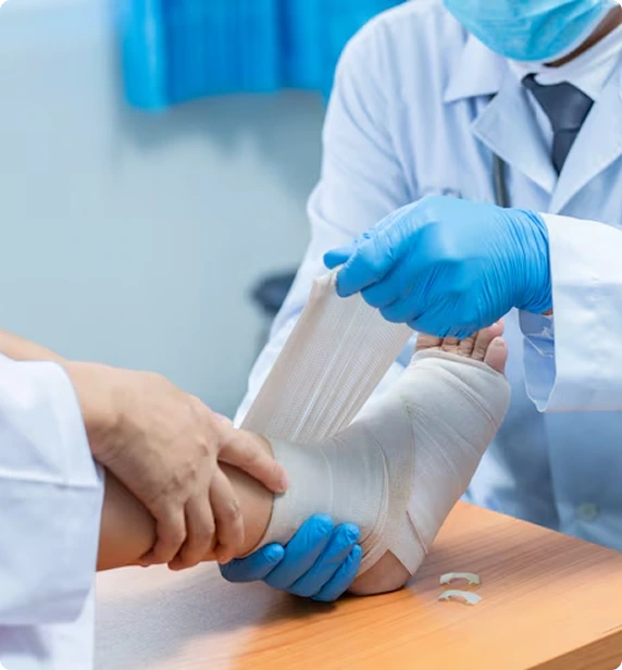 Doctor bandaging foot injury